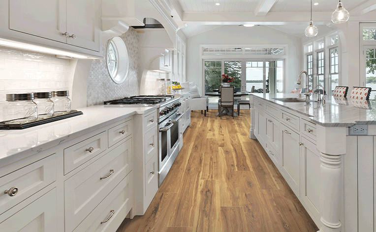 laminate flooring in kitchen with white cabinets